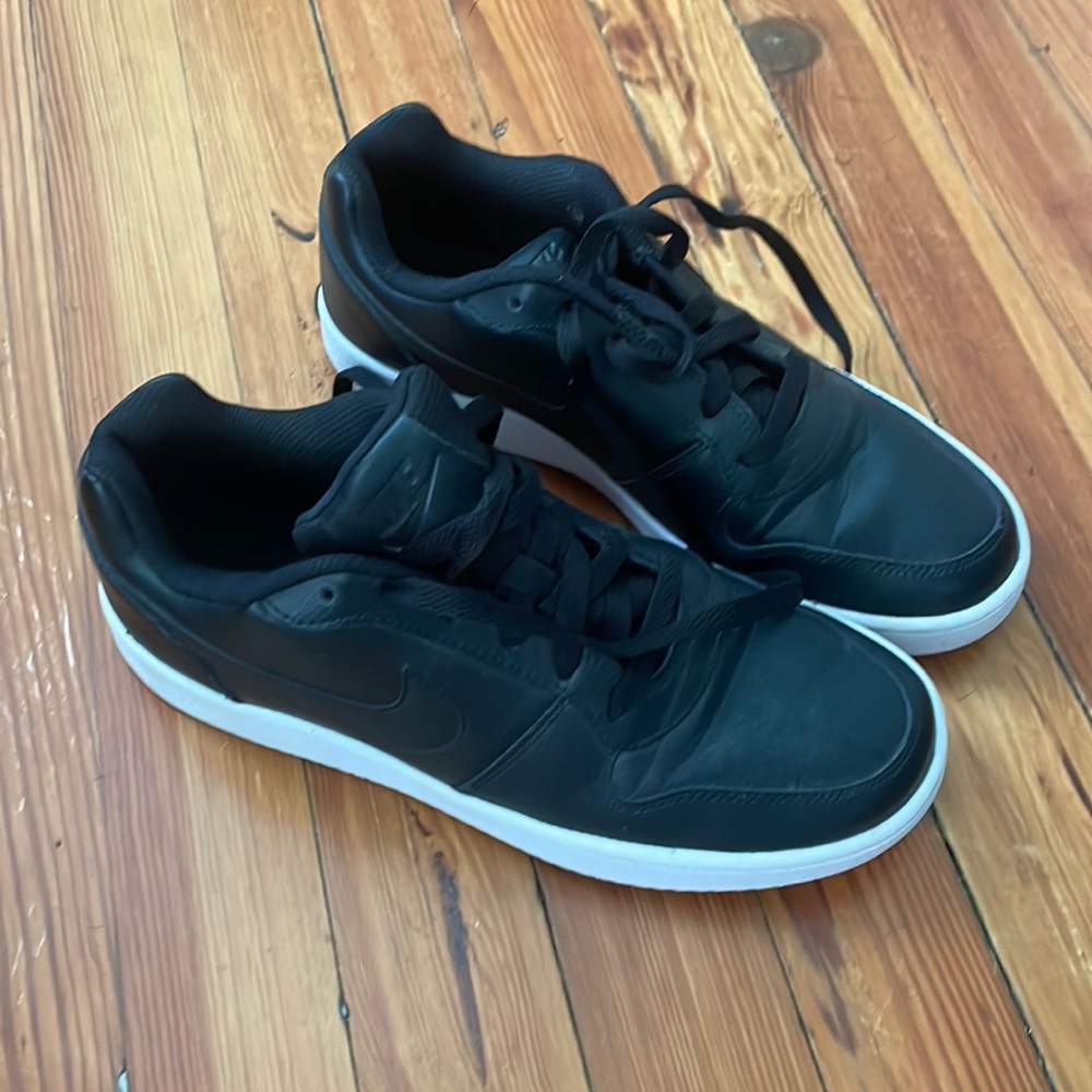 All black Nike low tops. Size 9